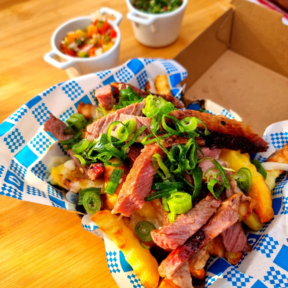 Brisket loaded fries with melted provolone, spring onion and chimichurri